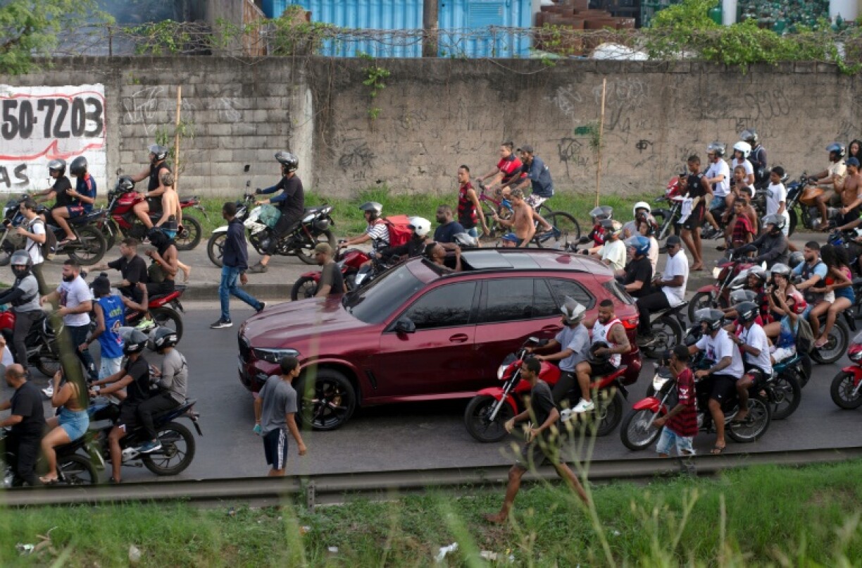 The car transporting MC Poze do Rodo is surrounded by fans after his release from Bangu 3 prison in of Rio de Janeiro, Brazil