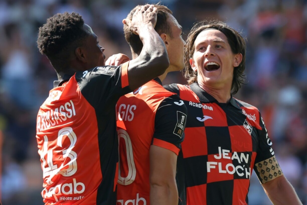 Pablo Pagis (C) celebrates putting promoted Lorient three up against nine-man Rennes