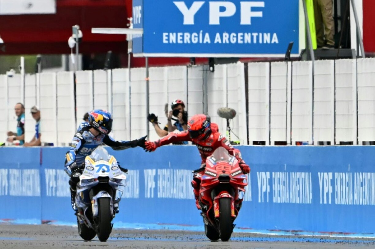 Brothers in arms: Alex Marquez (left) congratulates race winner Marc in Argentina