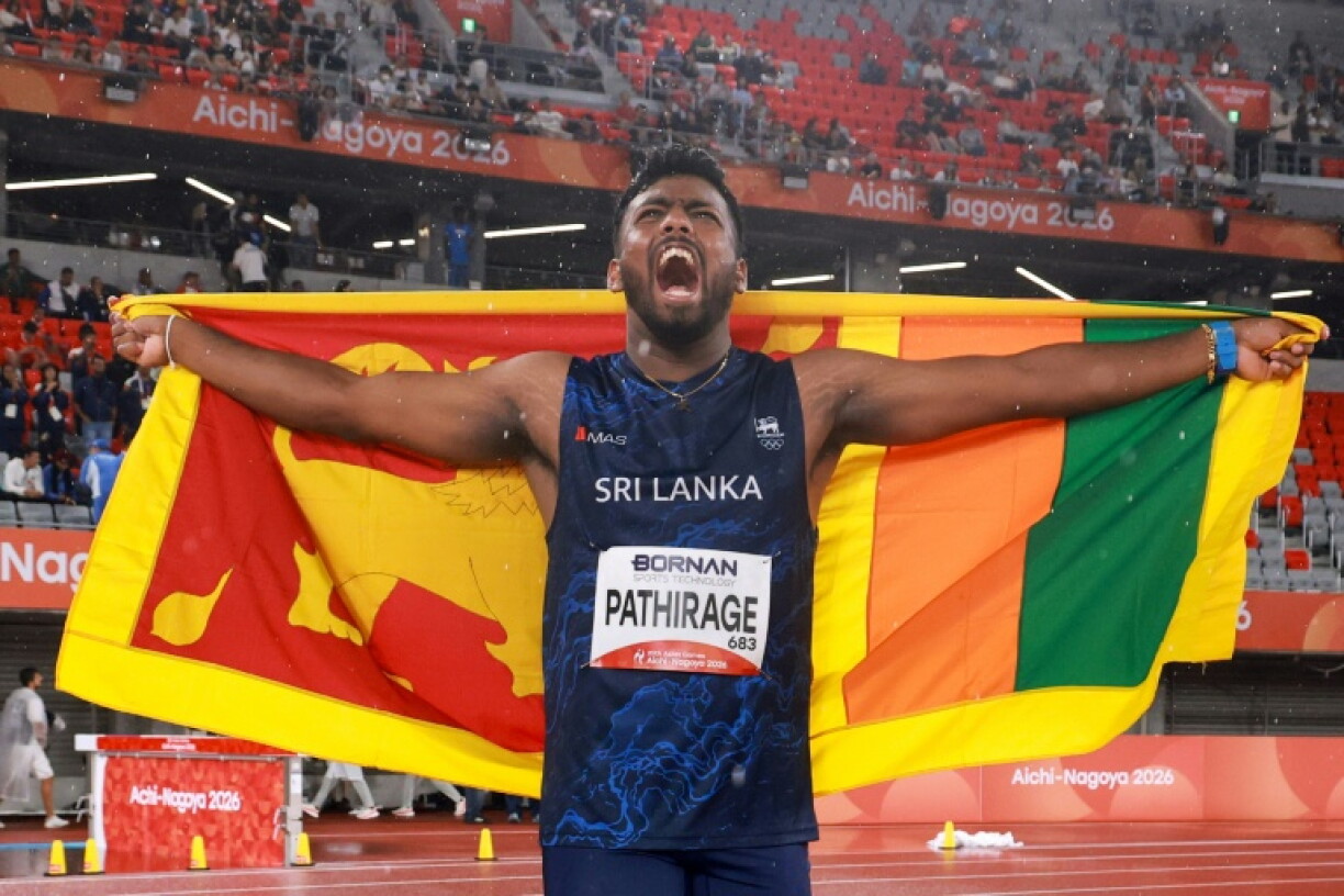 Sri Lanka's Rumesh Tharanga Pathirage celebrates after winning the men's javelin