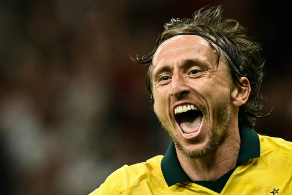 Luka Modric wheeled away in delight at his decisive strike for AC Milan