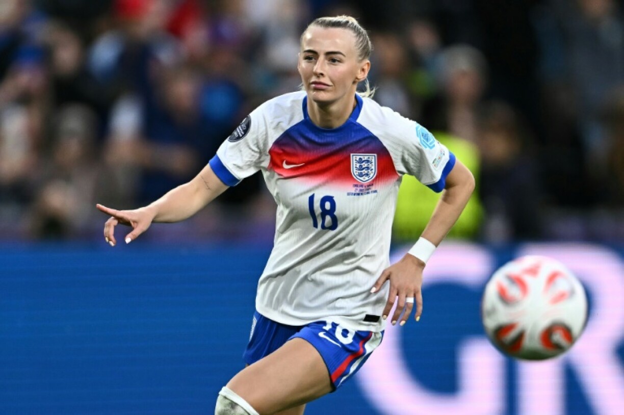 Chloe Kelly celebrates after scoring the winning penalty for England in the shoot-out against Spain in the Euro 2025 final
