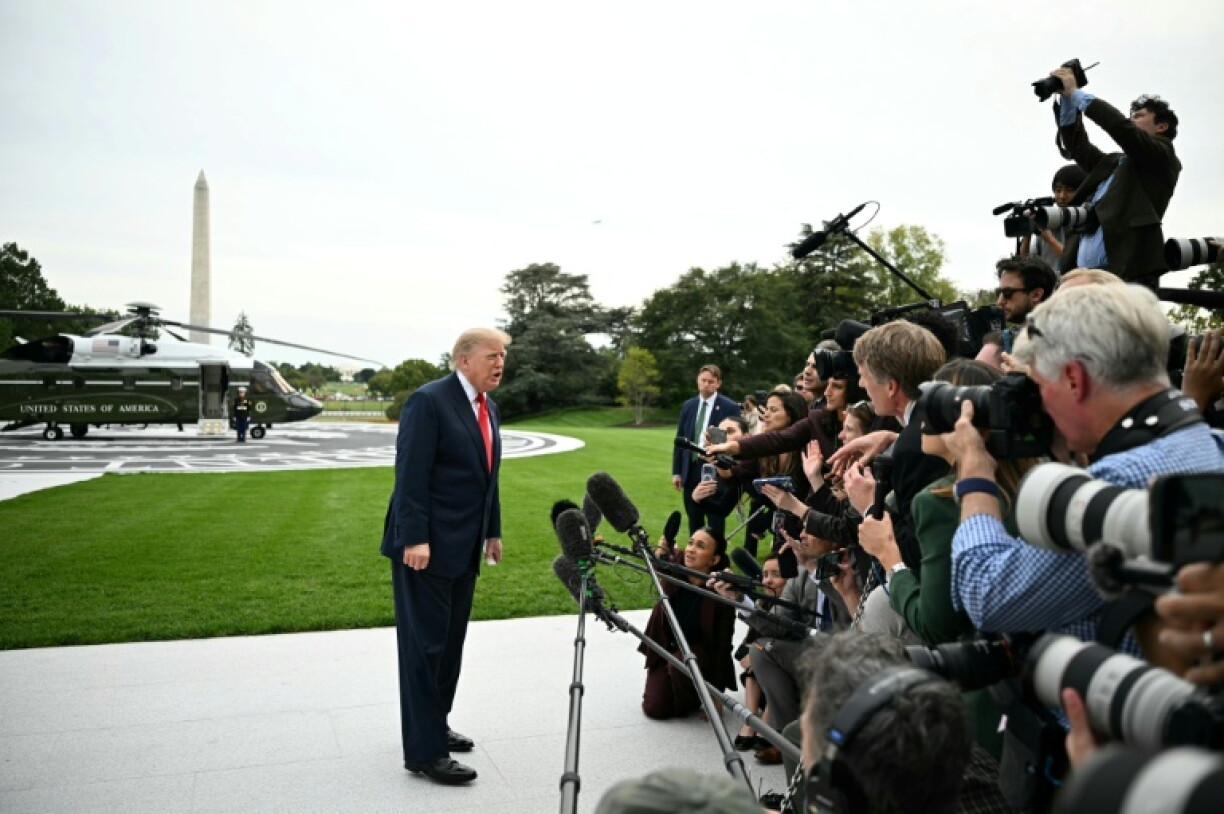 US President Donald Trump speaks to the press before boarding Marine One as he departs from the South Lawn of the White House in Washington, DC, on October 9, 2026