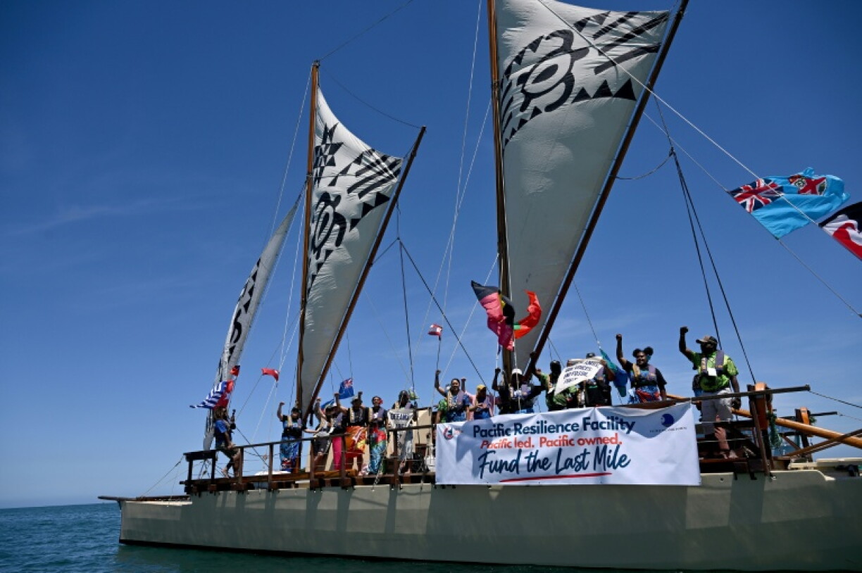 Climate advocates and Greenpeace campaigners sail towards the venue of the Pacific Pre-COP31 Summit in Nadi on October 7, 2026. Around 80 Pacific and Torres Strait community members, Elders and youth activists travelled in a colourful flotilla past the summit venue, delivering a message to leaders to "Keep 1.5°C Alive".