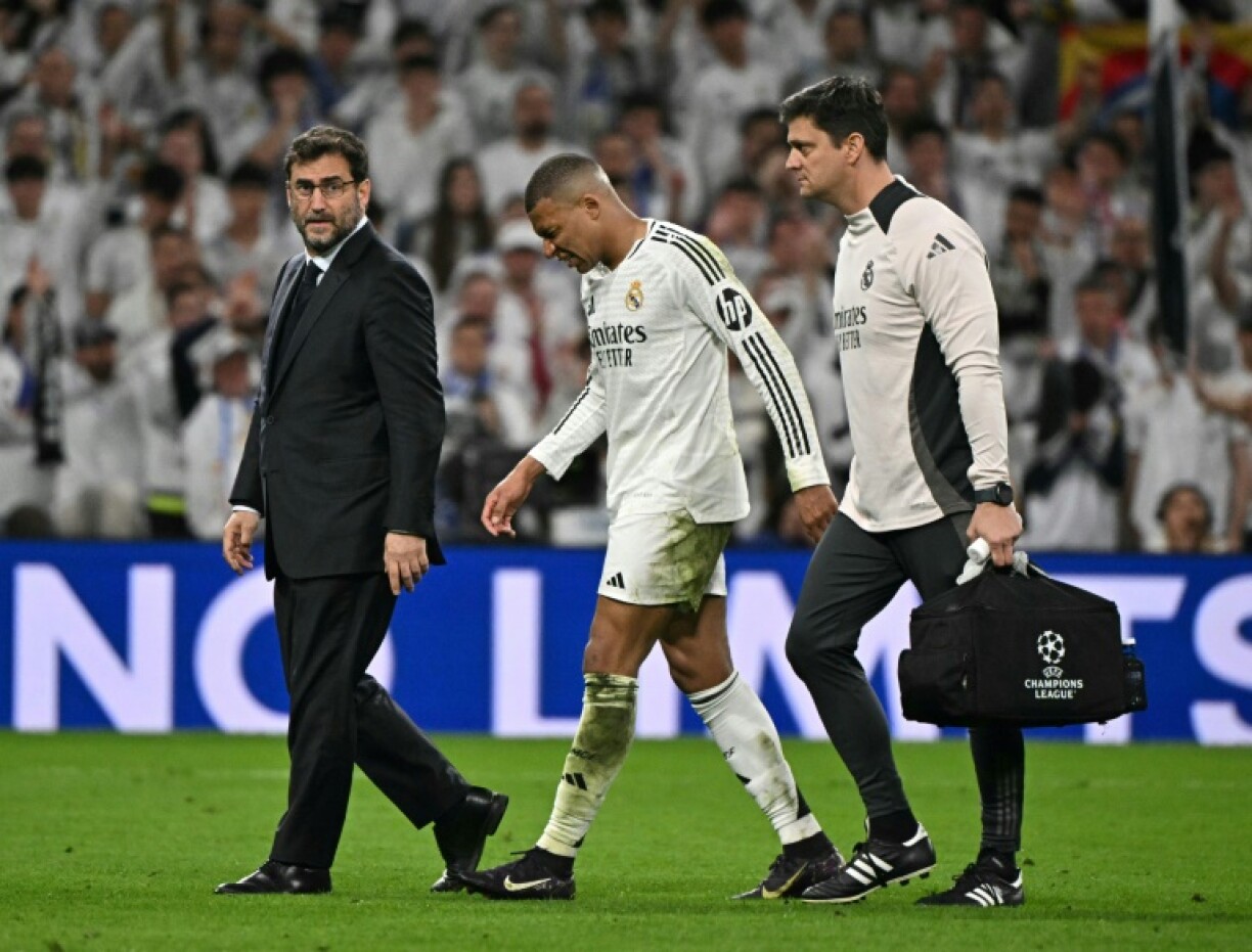 Kylian Mbappe hobbles of the pitch during REal Madrid's Champions League quarter final tie with Arsenal at the Santiago Bernabeu