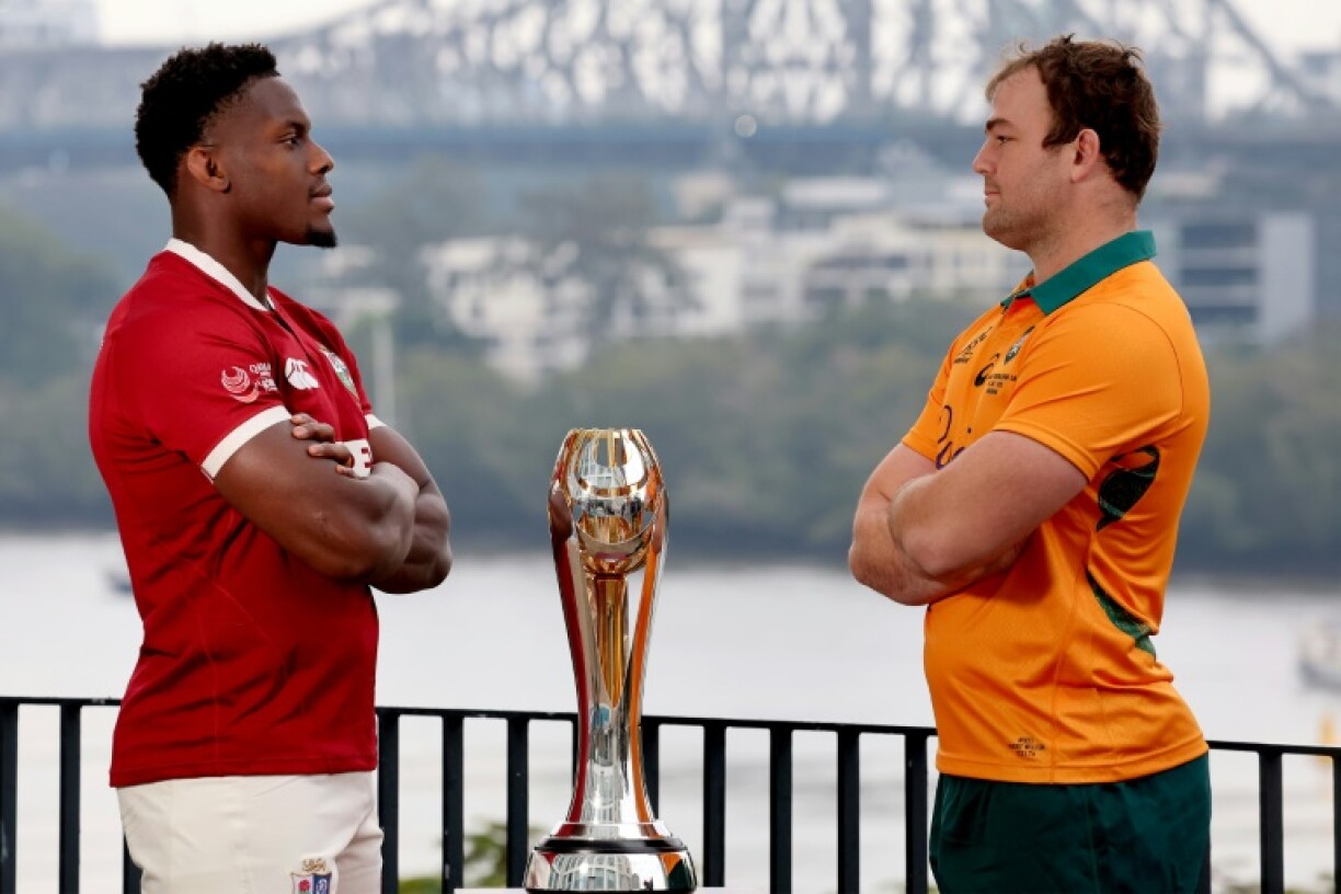 British and Irish Lions skipper Maro Itoje (L) and Australia captain Harry Wilson pose with the Tom Richards Cup in Brisbane
