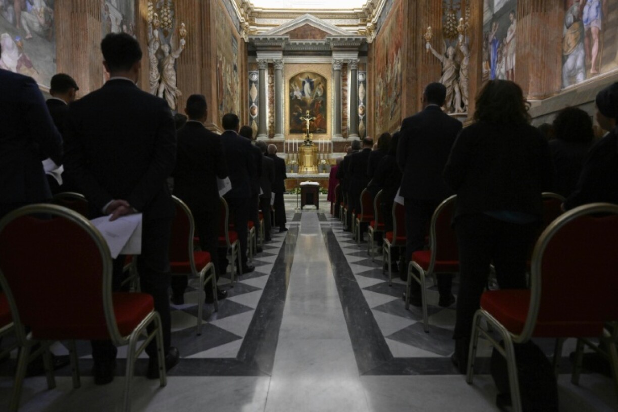Employees assisting the cardinals in the conclave take an oath of secrecy