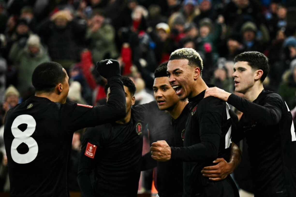 Aston Villa's Morgan Rogers (2nd R) celebrates after scoring against West Ham