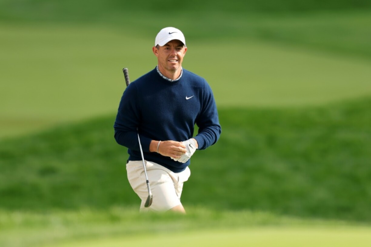 World number two Rory McIlroy of Northern Ireland walks to the 18th green during a practice round ahead of the 125th US Open at Oakmont