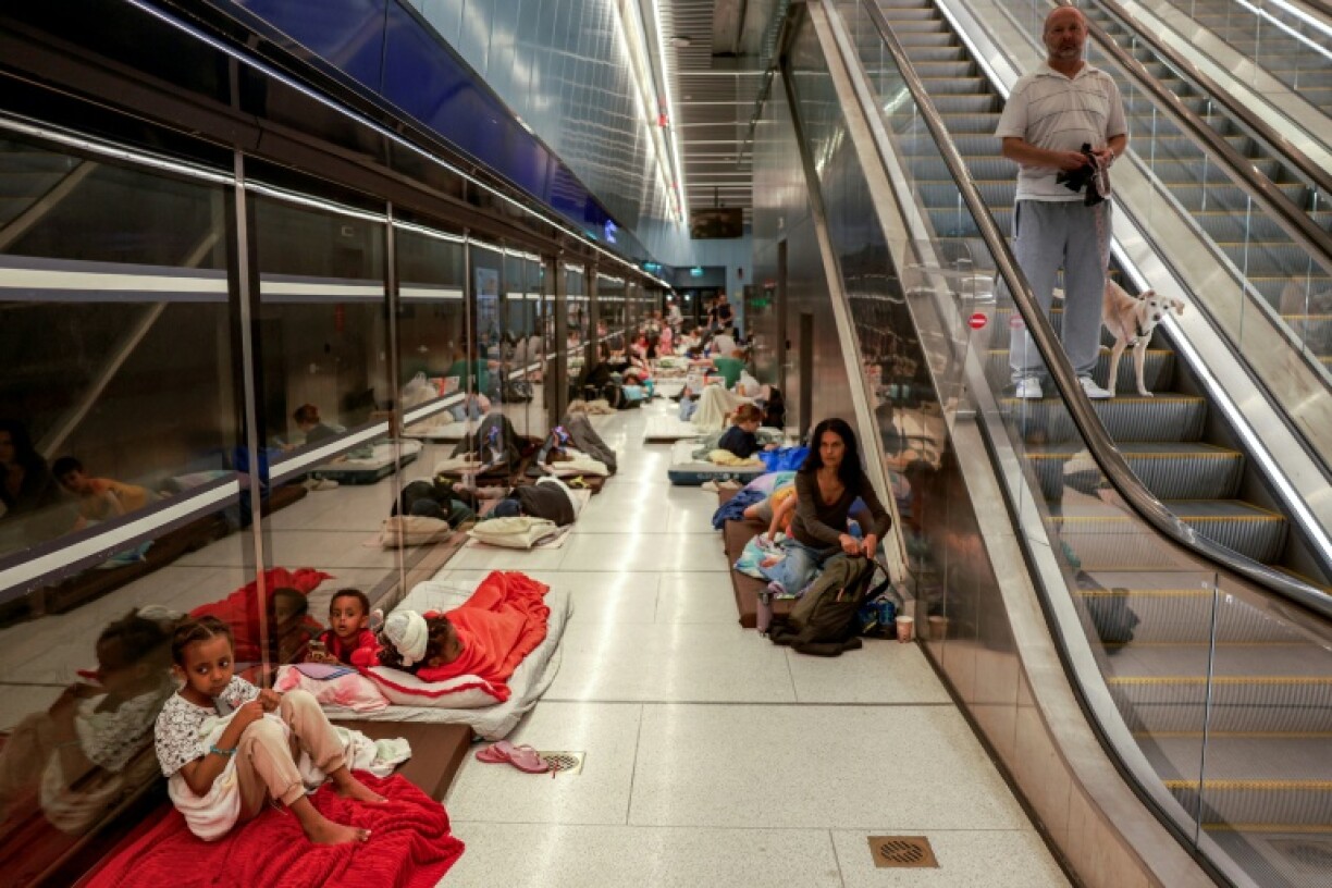 People take shelter in the Tel Aviv metro