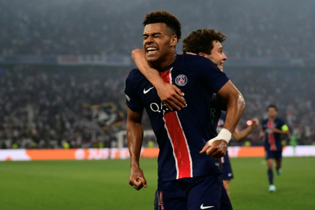 Desire Doue (L) celebrates after scoring one of his two goals in Paris Saint-Germain's resounding victory over Inter Milan in the Champions League final