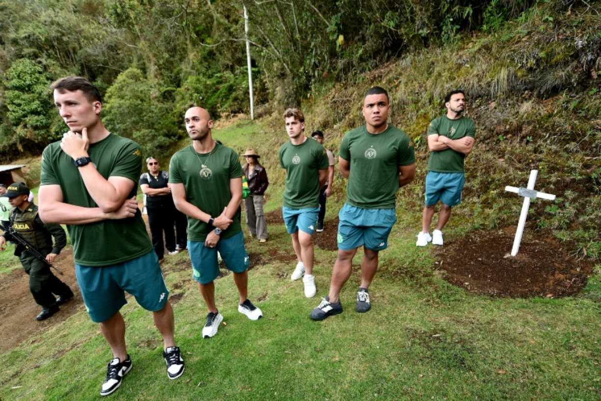 Players from Brazil's Chapecoense football team visit a memorial at the site of the squad's plane crash in Colombia, ahead of the 10th anniversary of the accident on Mt. Cerro Gordo