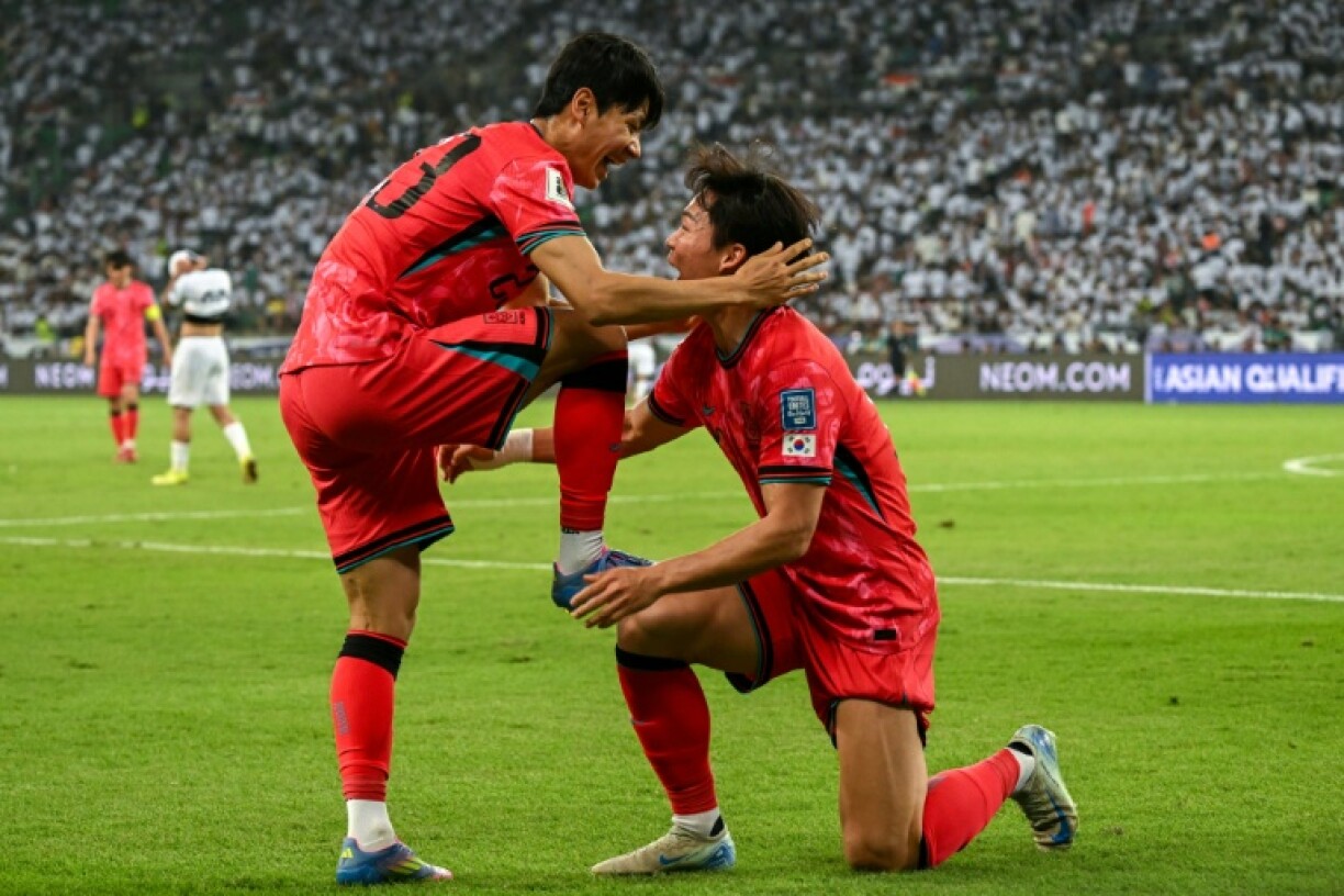 South Korea celebrate their second goal in Basra
