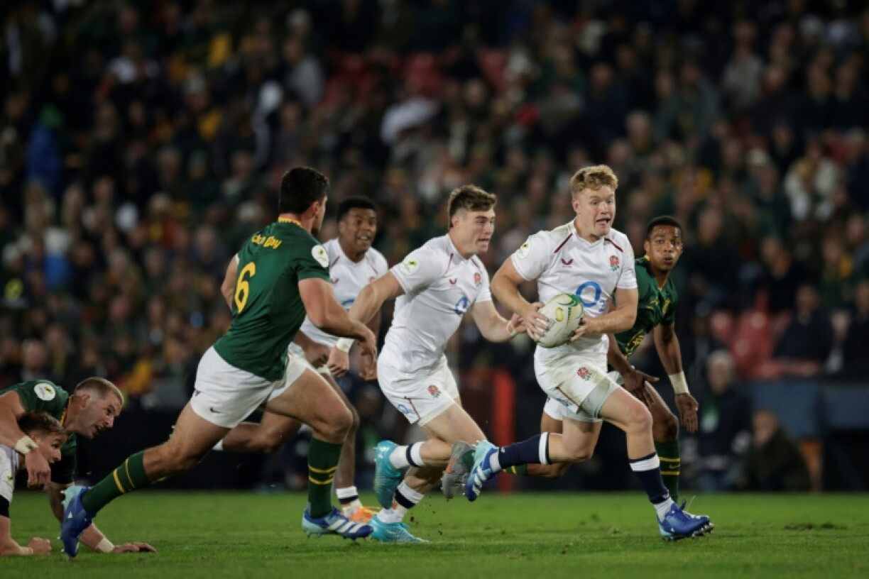 England fly-half Fin Smith runs with the ball during a Nations Championship match against South Africa at Ellis Park, Johannesburg in July