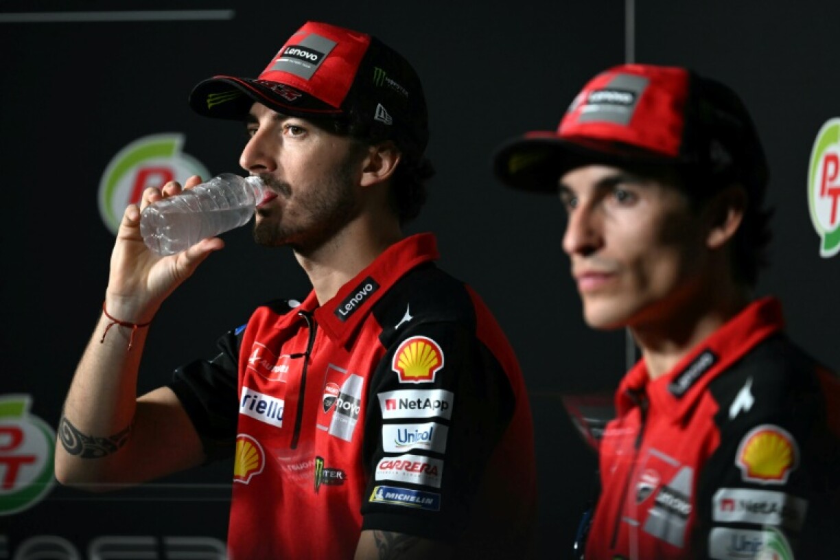 Francesco Bagnaia (L) and Marc Marquez take part in a press conference in Thailand