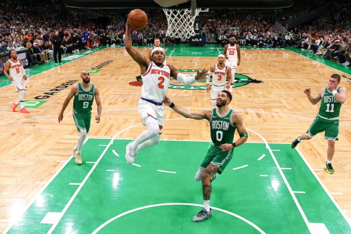 Miles McBride of the New York Knicks drives to the basket against Jayson Tatum in the Knicks' victory over the Boston Celtics in game two of their NBA playoff series