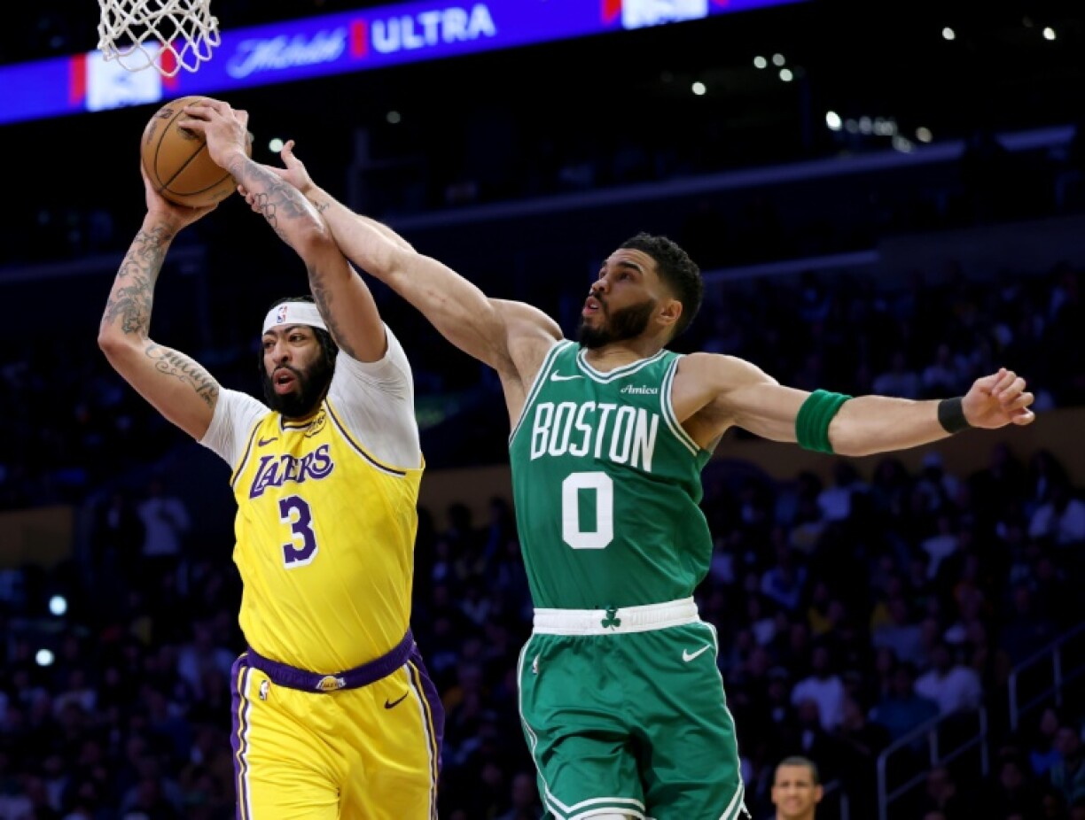 Anthony Davis (left) and Jayson Tatum (right) battle for possession in the Los Angeles Lakers clash with the Boston Celtics on Thursday