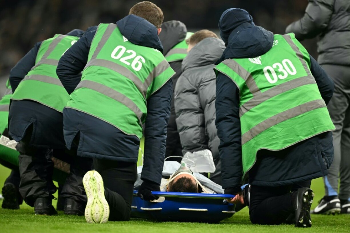 Tottenham's Uruguayan midfielder Rodrigo Bentancur on a stretcher before being carried off