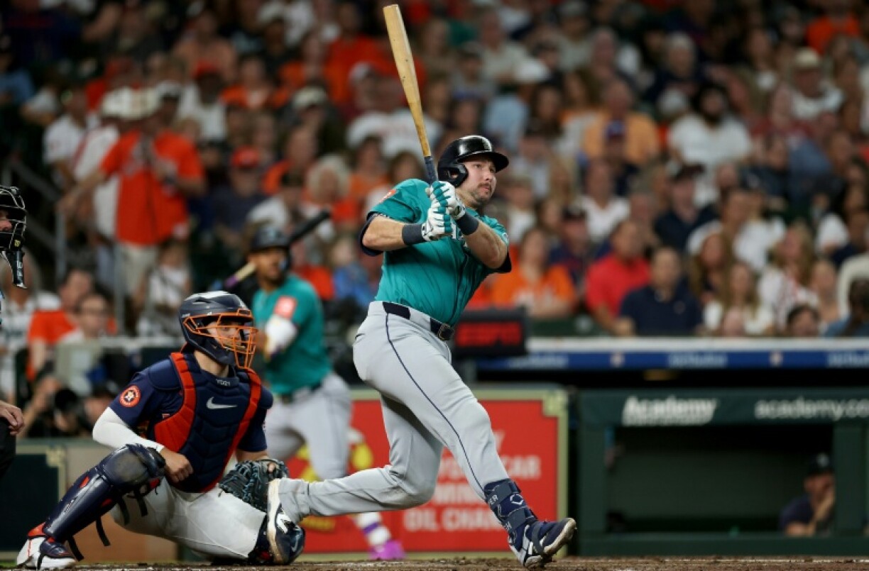 Cal Raleigh of Seattle hits a two run home run in the Mariners' MLB victory over the Houston Astros