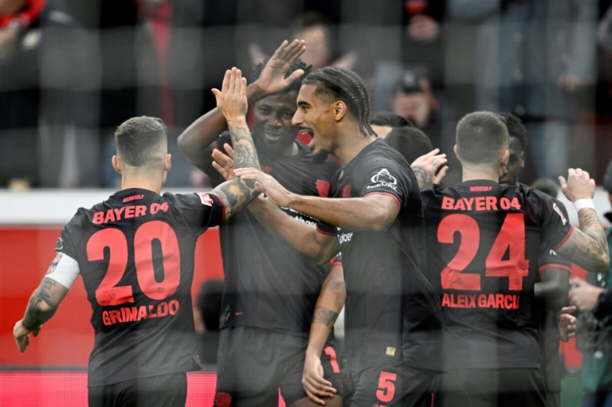 Bayer Leverkusen celebrate Edmond Tapsoba's second-half goal in Sunday's 2-0 win over Freiburg.