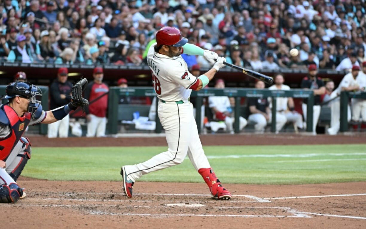Eugenio Suarez of the Arizona Diamondbacks hits a two run home run in the fourth inning against the Atlanta Braves