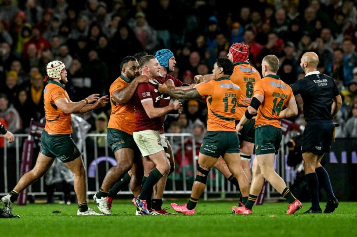 Australia and British and Irish Lions team players scuffle during a chaotic third Test