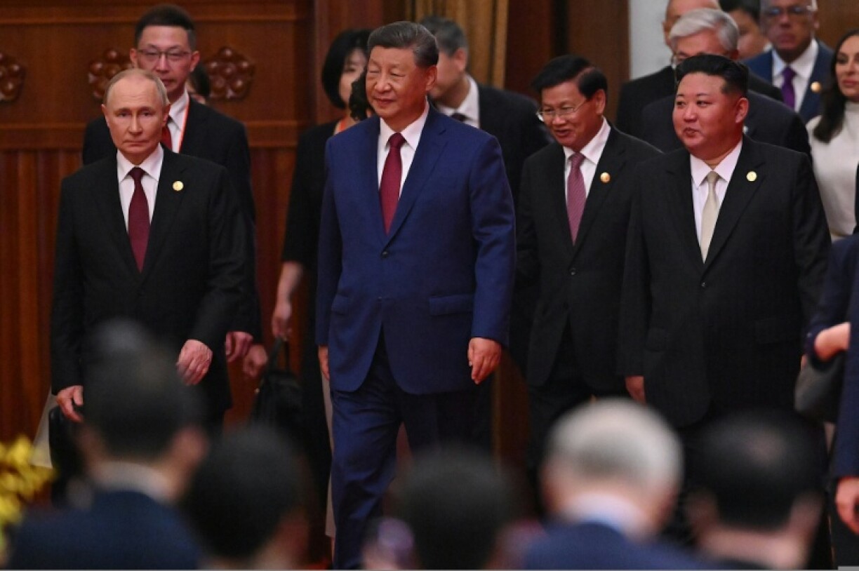 China's President Xi Jinping (C), North Korea's leader Kim Jong Un (R) and Russia's President Vladimir Putin (L) in Beijing for a military parade