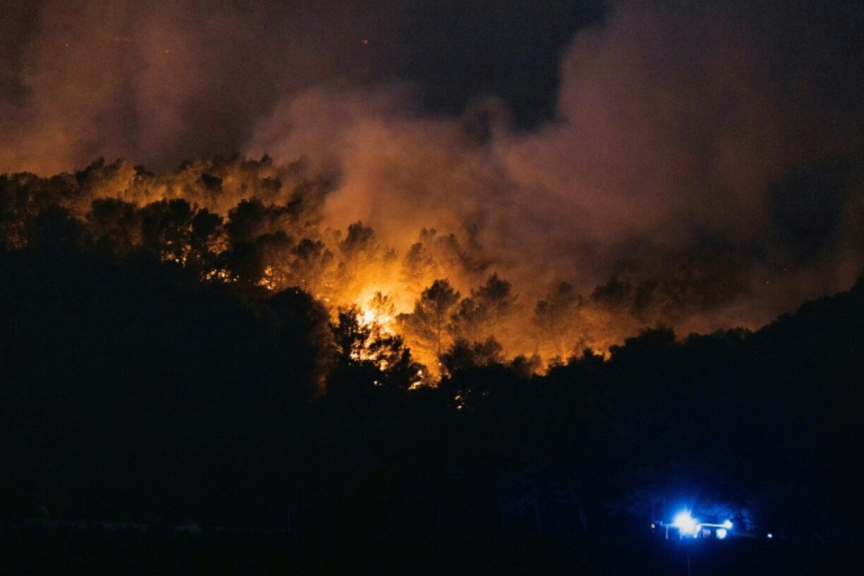 Smoke billows from a forest fire in southern France
