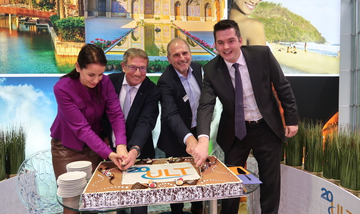 New Tourism Minister Lex Delles (on the far right) taking part in a cake-cutting ceremony at the holiday fair.