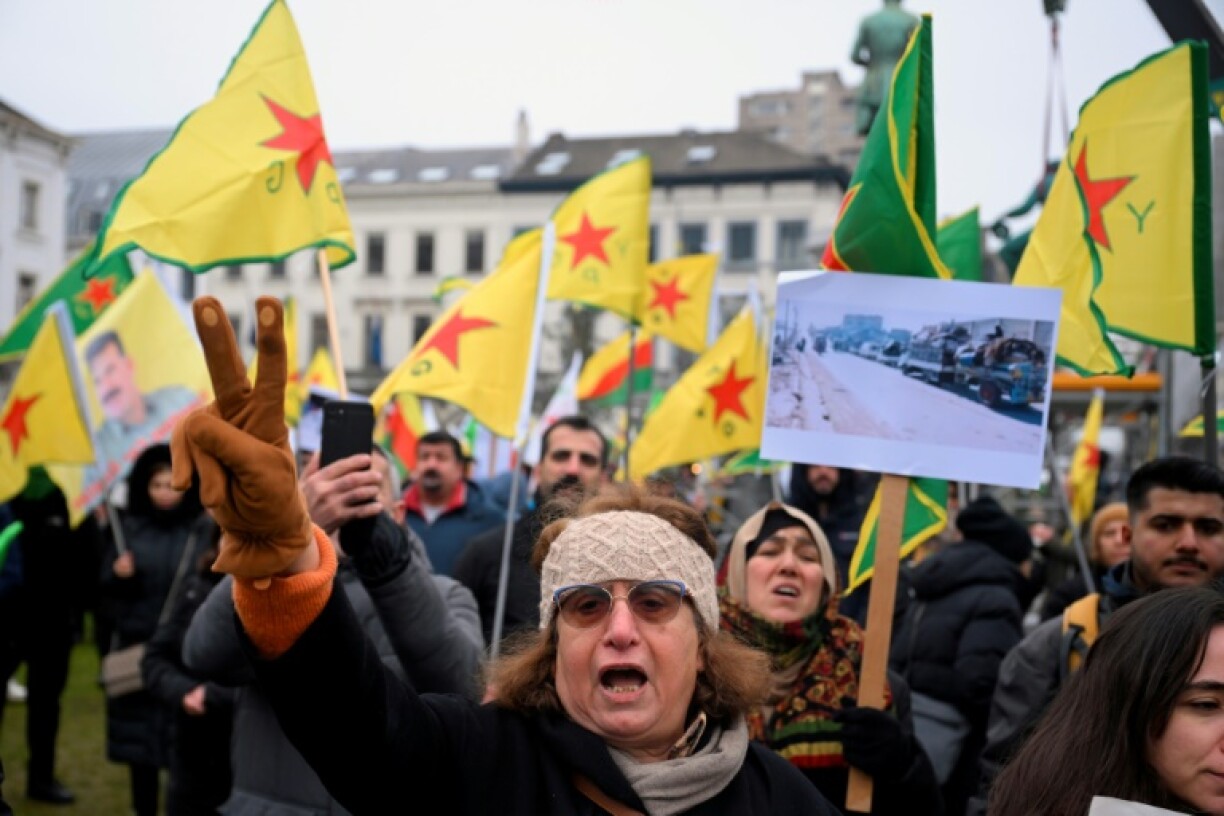 Demonstrators rally outside the European Parliament in Brussels to call for international protection for Syria's Kurds. community wave flags of YPG (People's Protection Units) in front of the EU Parliament in Brussels, on December 11, 2024, asking the international community and the EU to protect the Kurds in Syria. The Kurdish-led force controlling northeast Syria said on December 11, 2024 it had reached a US-brokered ceasefire with Turkish-backed fighters in Manbij, after Islamist-led rebels toppled Bashar al-Assad's government.