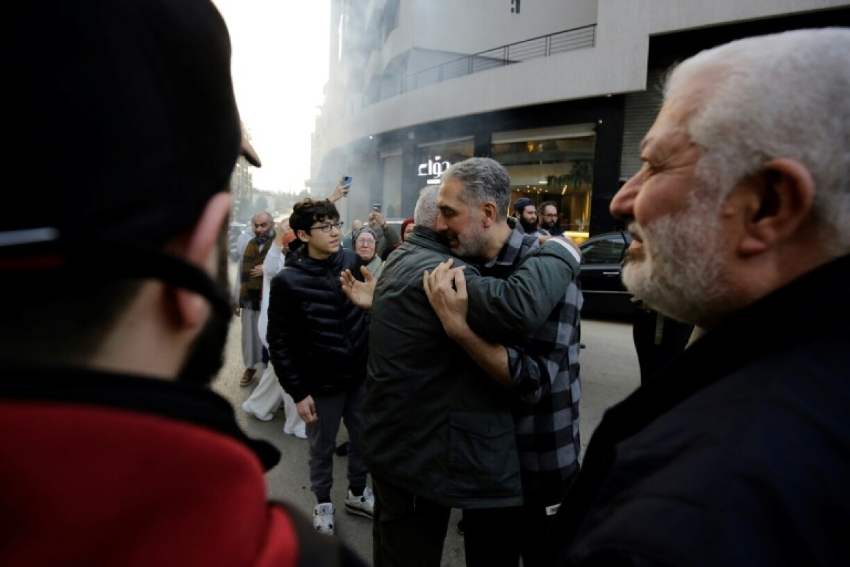 Moaz Merheb, 51, is received by his family and friends after 18 years of incarceration in Syria's notorious Saydnaya prison.