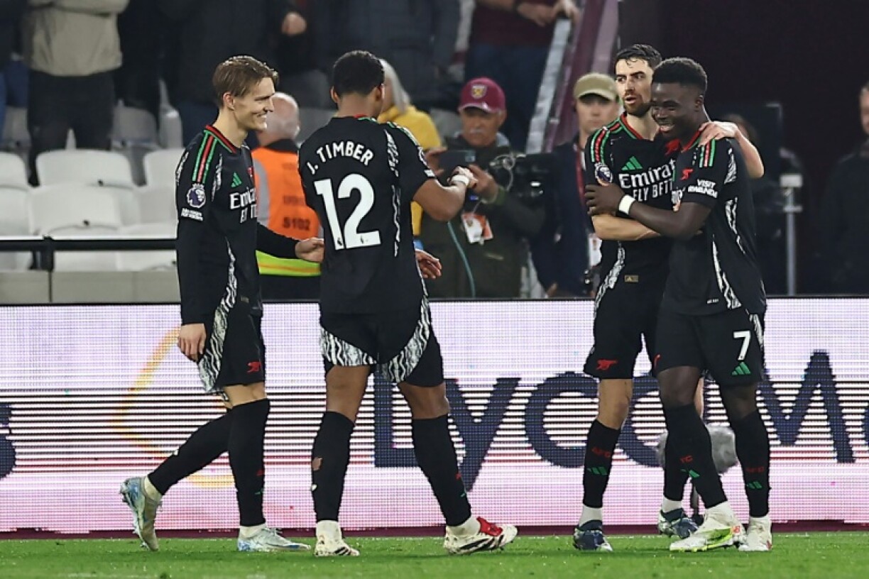 Arsenal celebrate during their victory at West Ham
