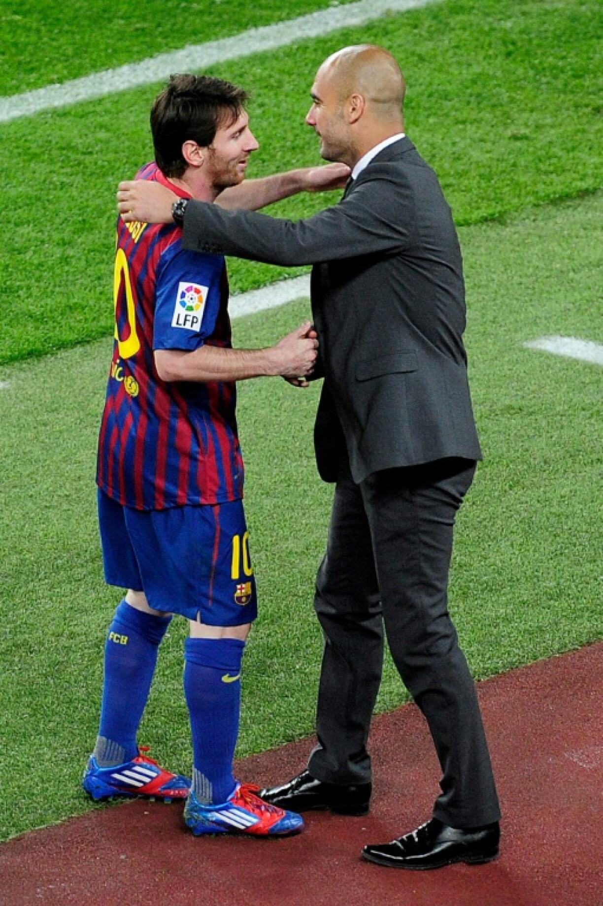 Lionel Messi et Pep Guardiola le 5 mai 2012, après un but de l'attaquant argentin au Camp Nou contre l'Espanyol Barcelone