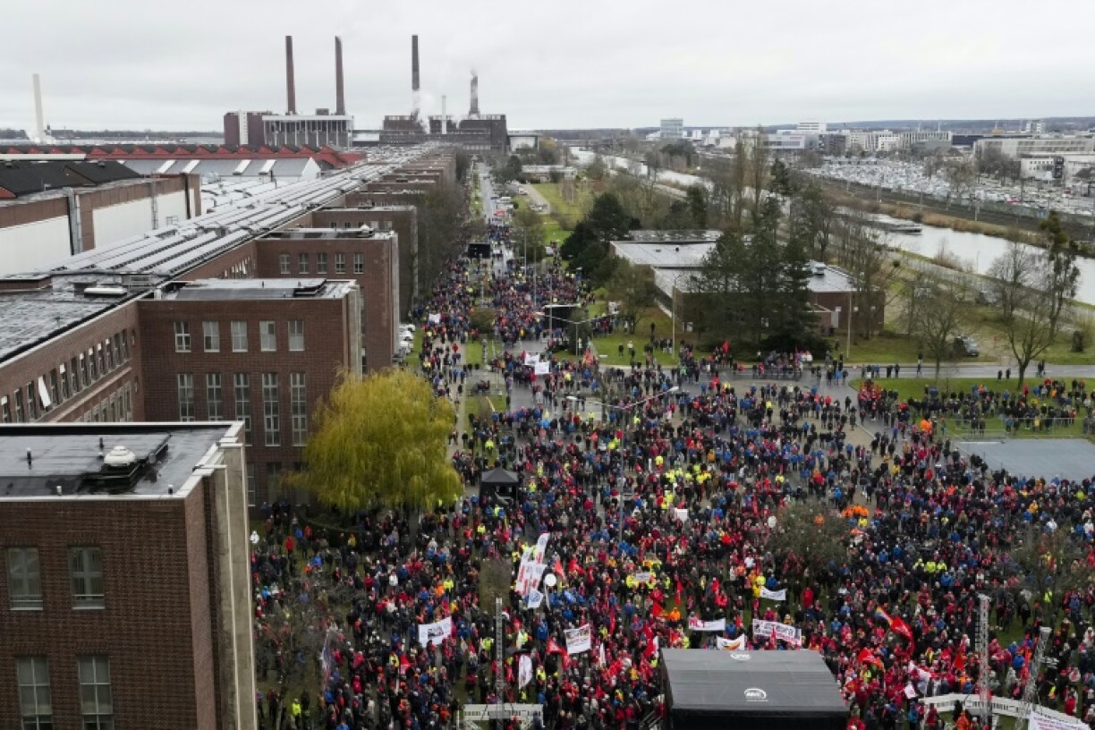 The German union IG Metall reached an agreement with Volkswagen on a cost-cutting plan to avoid forced redundancies at Europe's largest carmaker's production sites in Germany