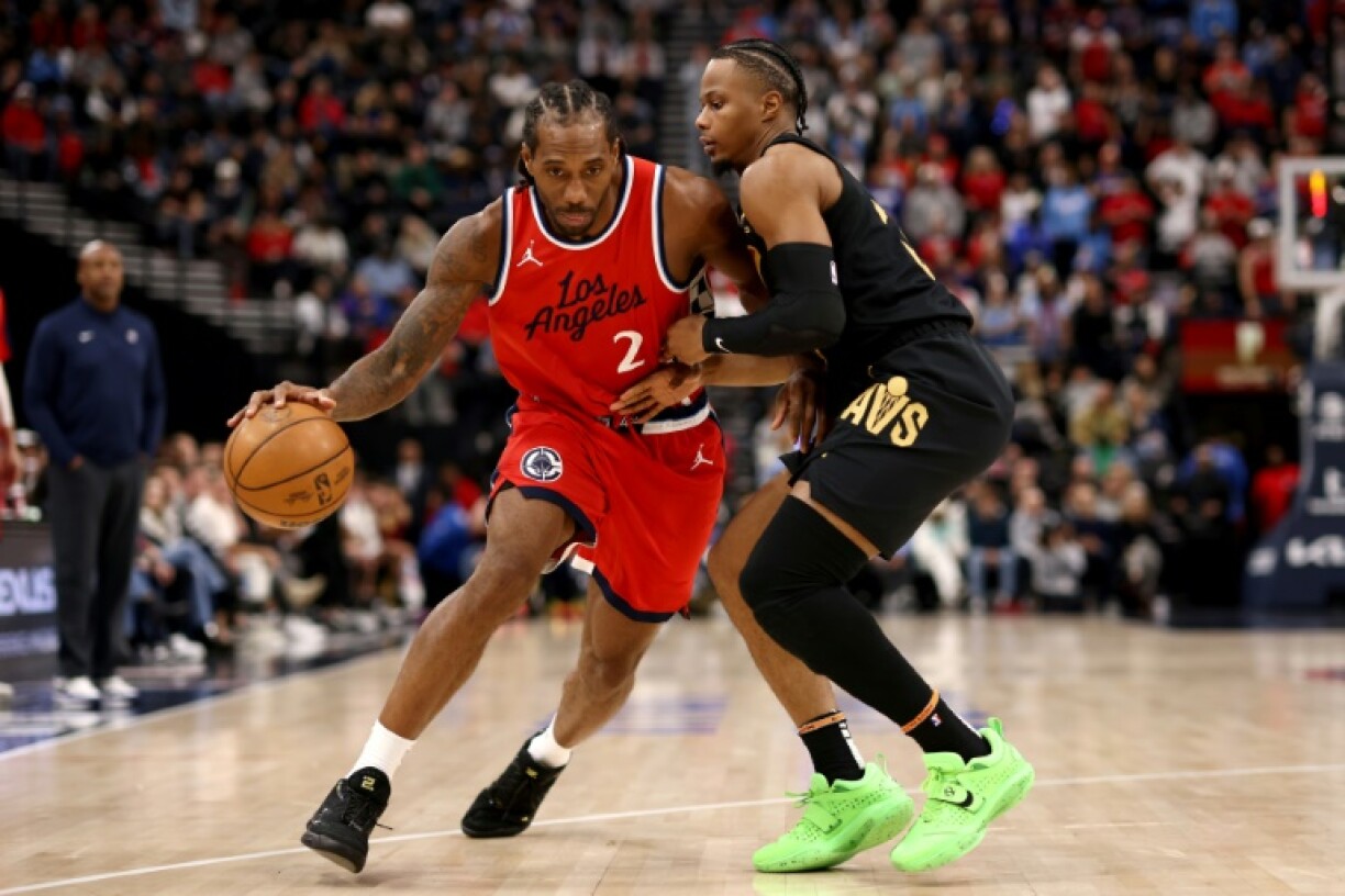 Kawhi Leonard of the Los Angeles Clippers drives to the basket against Isaac Okoro in the Clippers' NBA victory over the Cleveland Cavaliers
