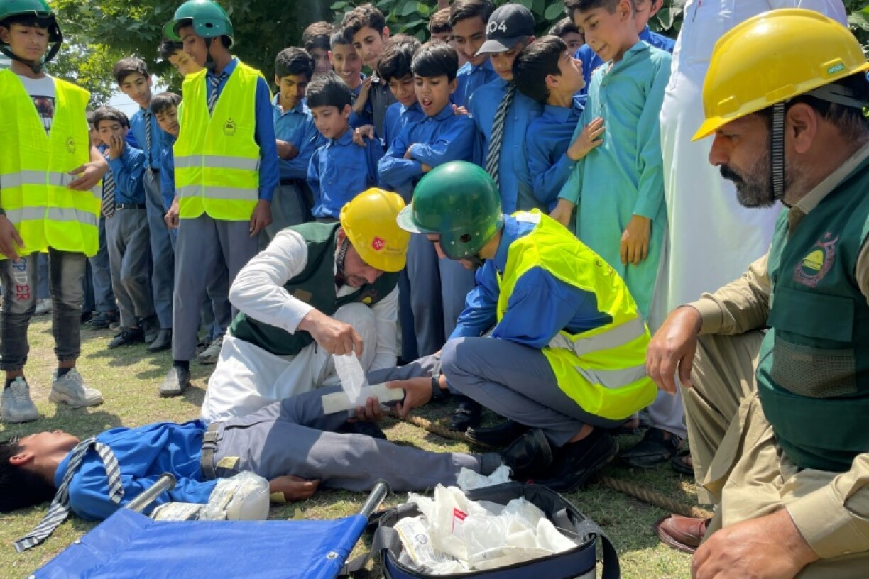 Workers from Pakistan's Civil Defence Department give first aid training for schoolchildren as tensions rise with India over a deadly attack in disputed Kashmir