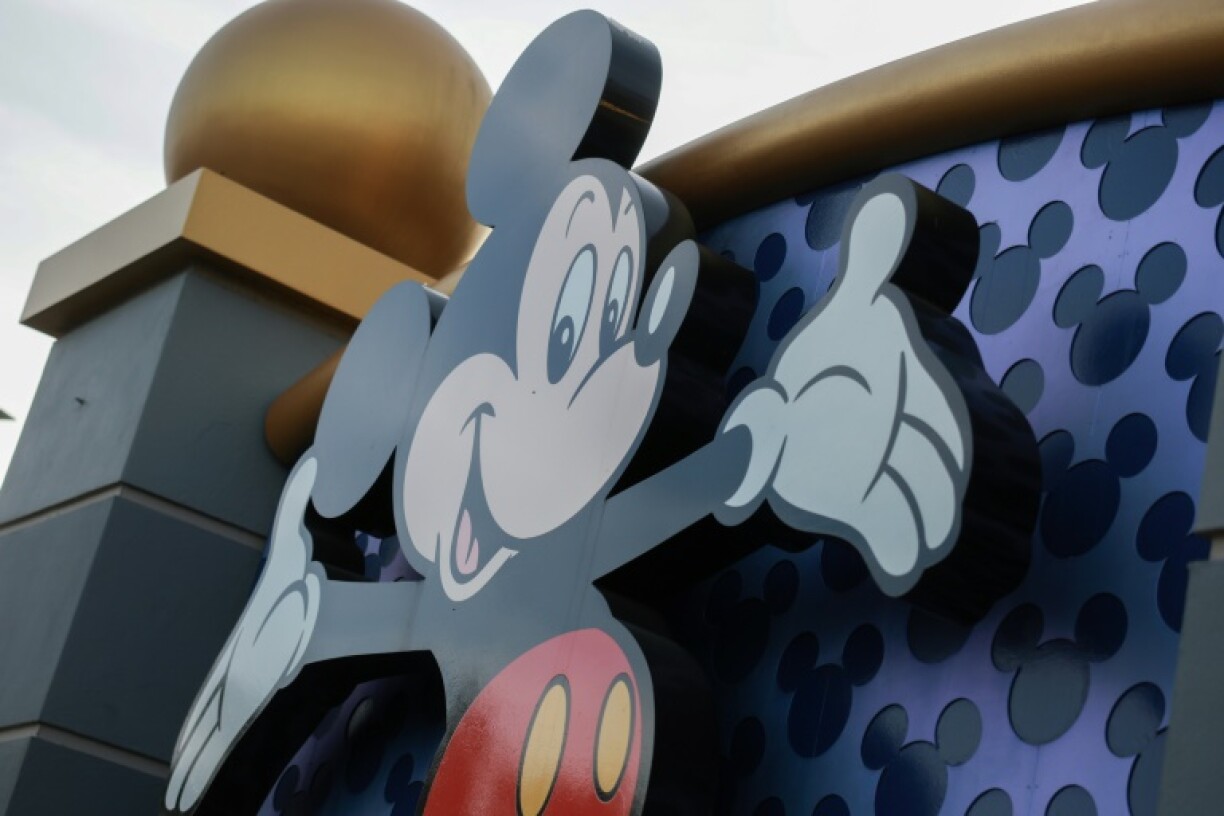 Mickey Mouse welcomes visitors near an entrance to Walt Disney World in Orlando, Florida