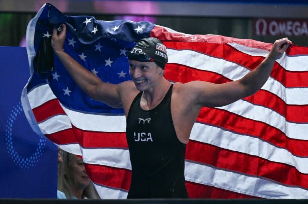 Katie Ledecky celebrates with the United States flag