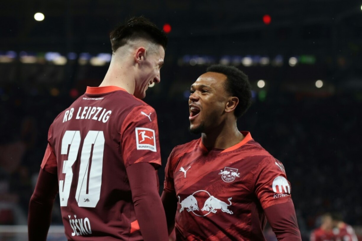 Leipzig forward Benjamin Sesko (L) and Lois Openda (R) celebrate their win over Eintracht Frankfurt