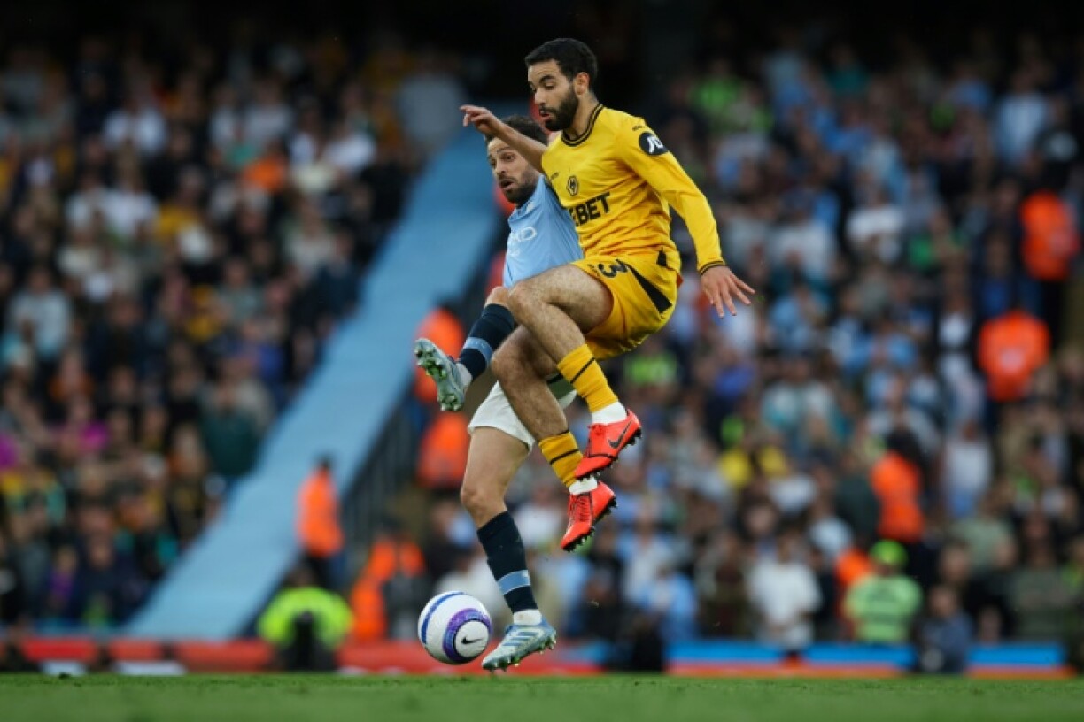 Wolves' Rayan Ait-Nouri (front) is set to join Man City