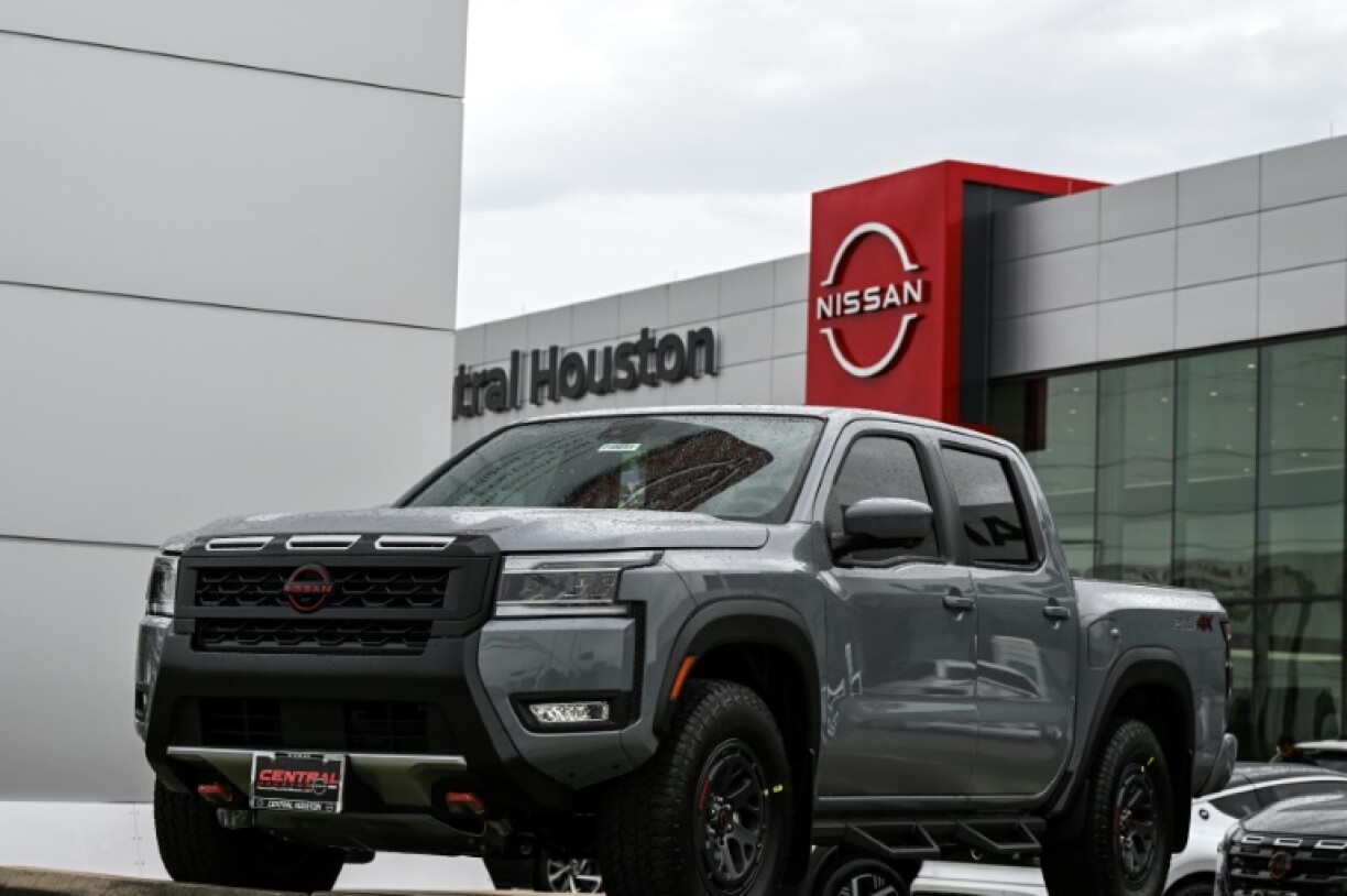 A Nissan Frontier pickup truck -- a type of vehicle highly popular in Texas -- is parked in front of a dealership in Houston