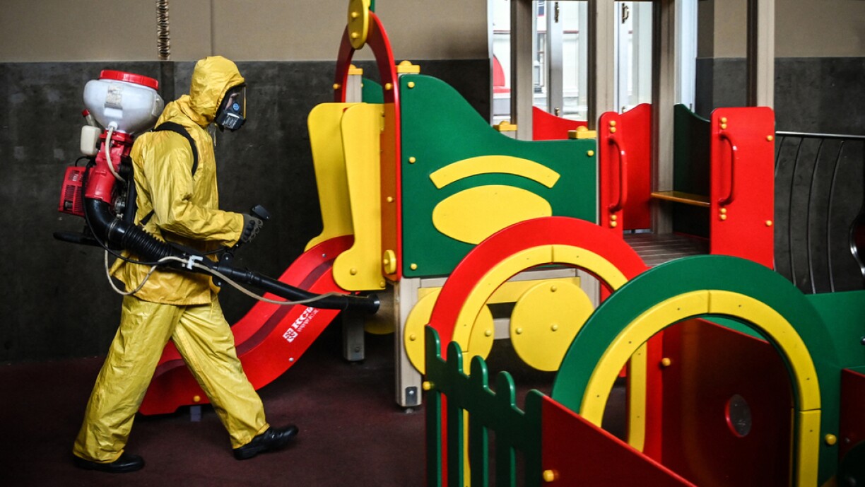 A serviceman of Russia's Emergencies Ministry, wearing protective gear, disinfects Kievsky railway terminal amid the COVID-19 pandemic in Moscow on 22 September 2021.