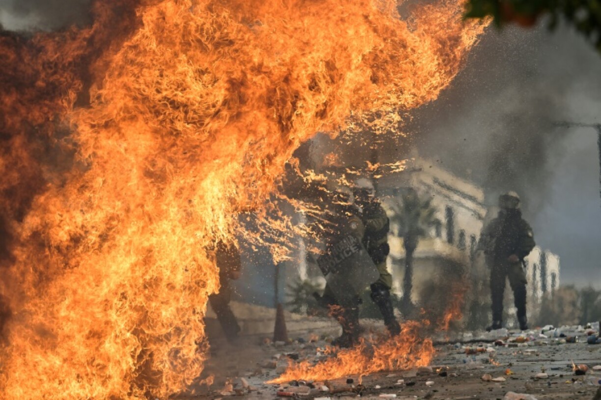 Riot police clashed with some protesters who threw petrol bombs outside the Greek parliament