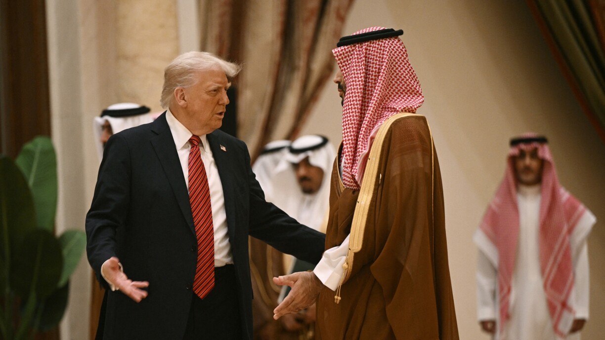 US President Donald Trump speaks with Saudi Crown Prince Mohammed bin Salman before posing for a family picture with Gulf leaders during a gathering of the six-nation Gulf Cooperation Council (GCC) in Riyadh on 14 May 2025.