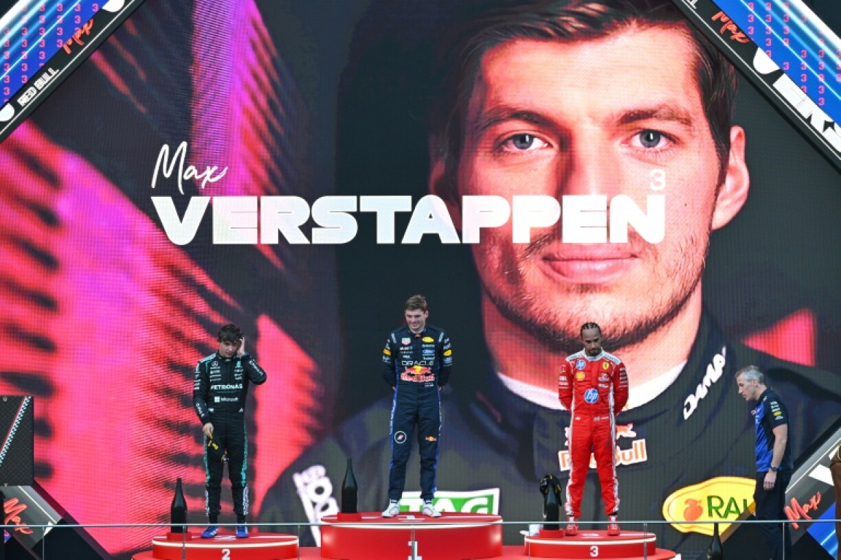 Max Verstappen (C) stands on the top step of the podium for the first time this season after edging Kimi Antonelli (L) and Lewis Hamilton (R)