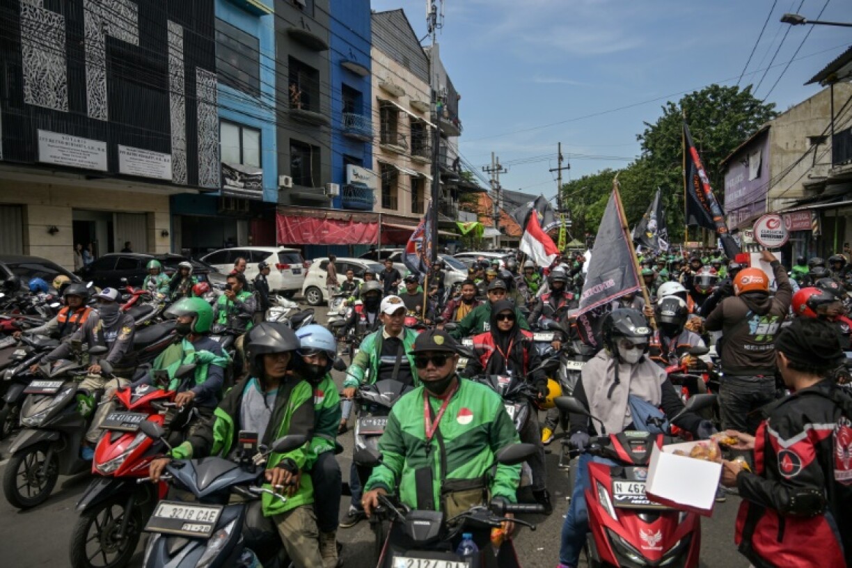 Gig economy drivers protested in Indonesia demanding a 10 percent cap on commission fees