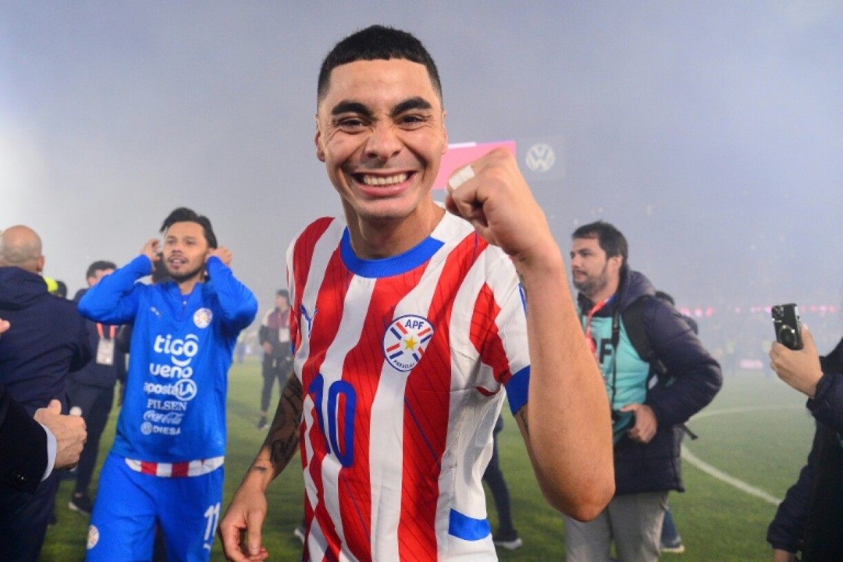 Paraguayan midfielder Miguel Almiron celebrating his team's qualification for the 2026 World Cup
