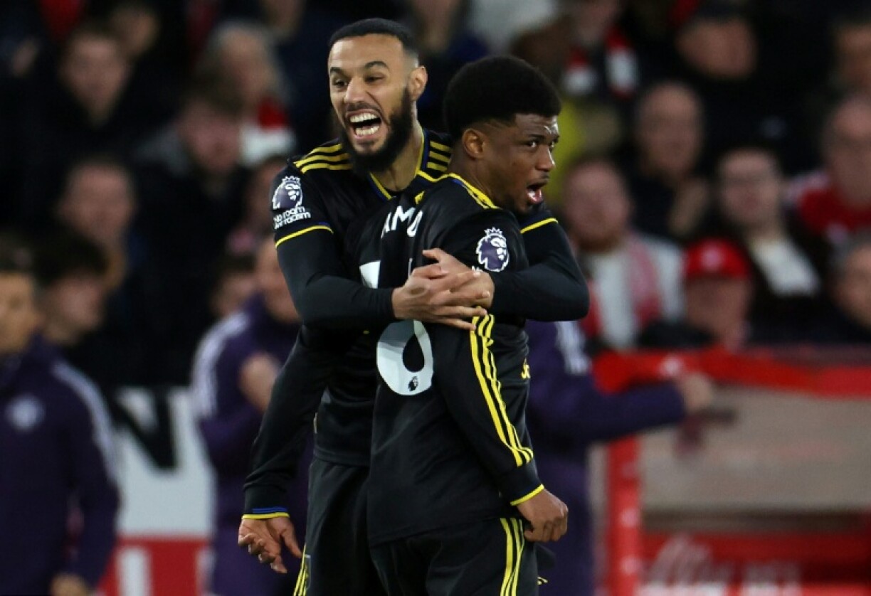 Manchester United forward Amad Diallo (R) celebrates scoring an equaliser against Nottingham Forest