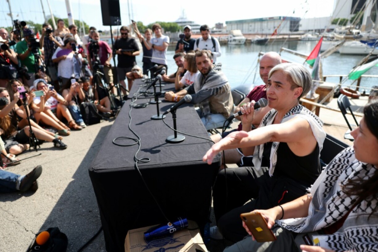 Former Barcelona mayor Ada Colau delivers a speech at the flotilla launch