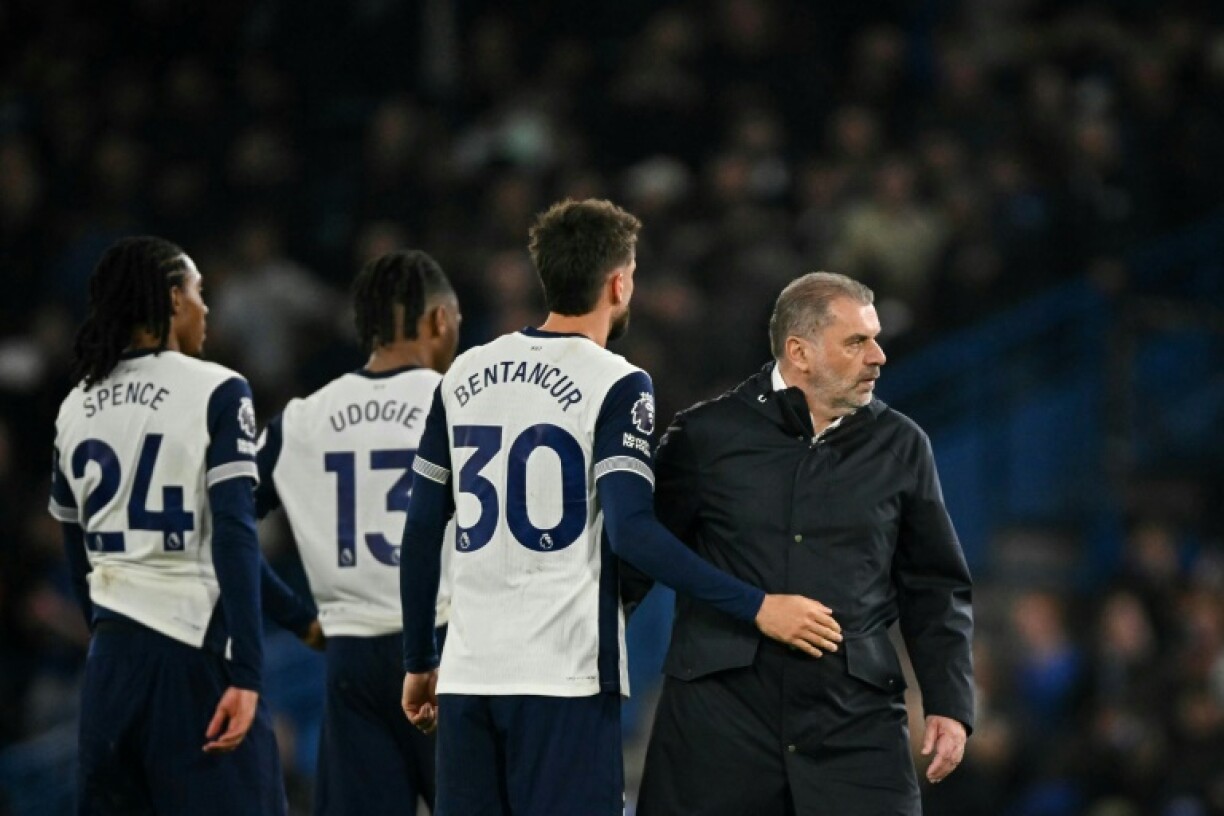 Tottenham boss Ange Postecoglou and his players reacts after their defeat at Chelsea
